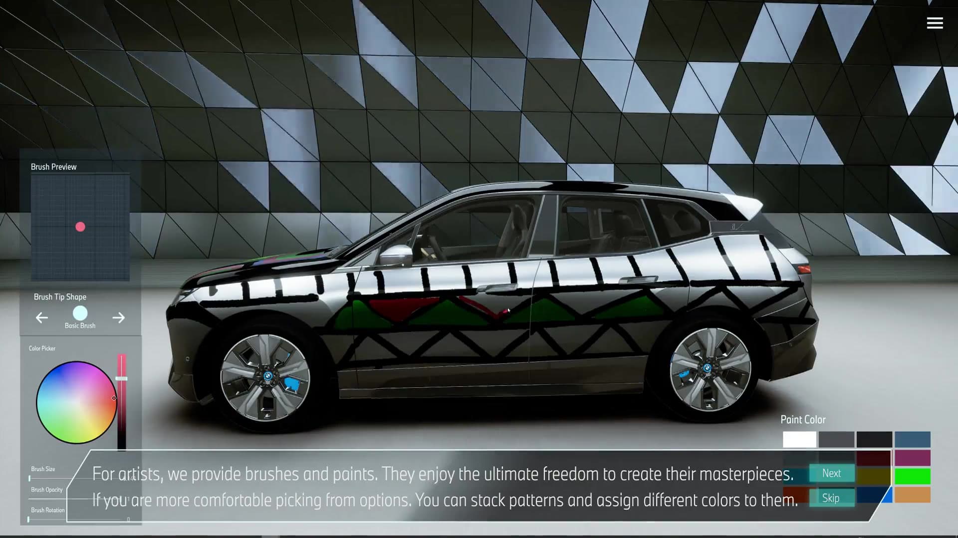 BMW iX painted with a custom geometric livery inside the virtual experience center